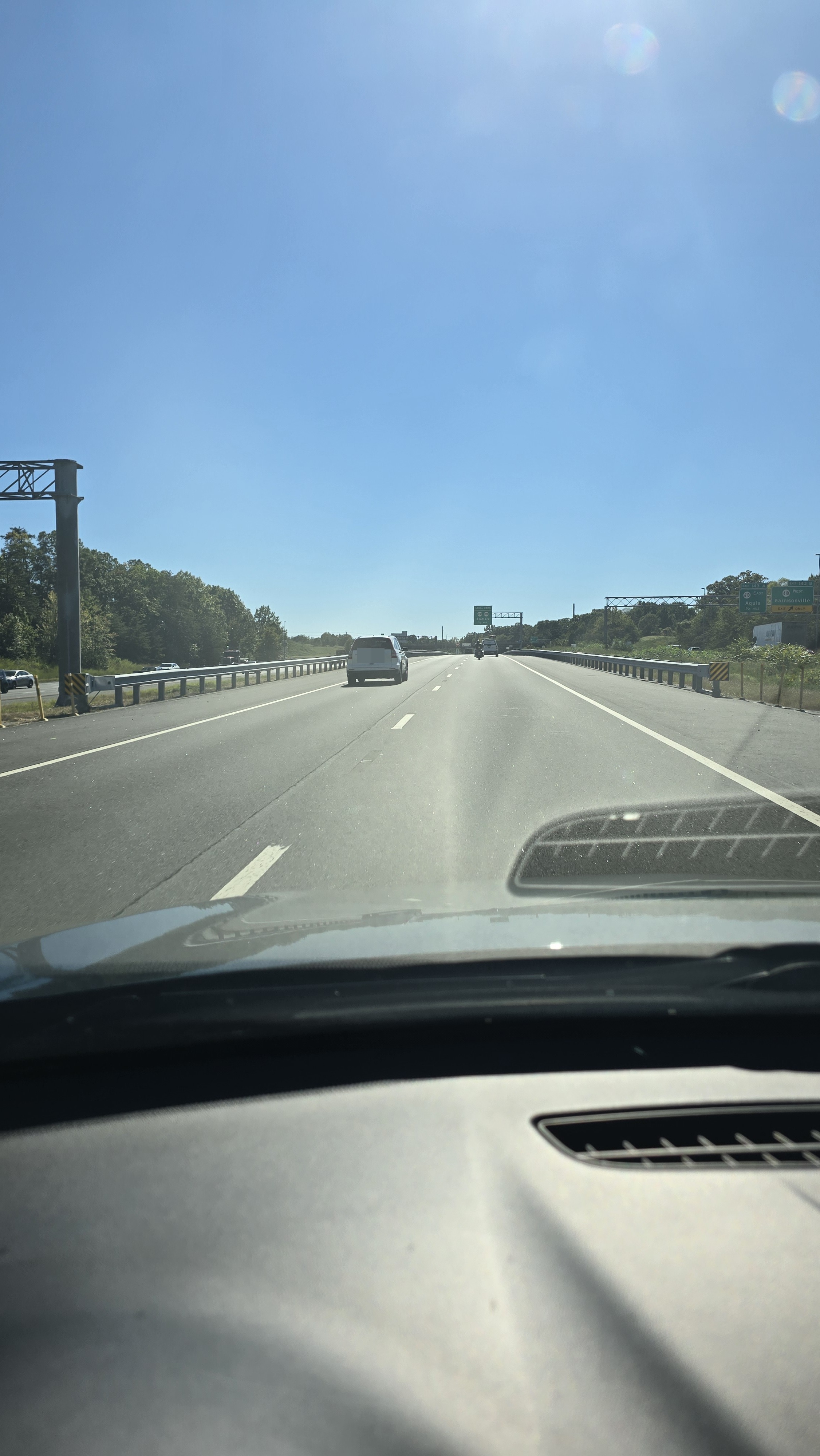 Vehicles traveling on a multi-lane highway with traffic using the left passing lane